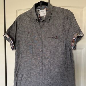 Men’s size M denim and flower button down shirt.